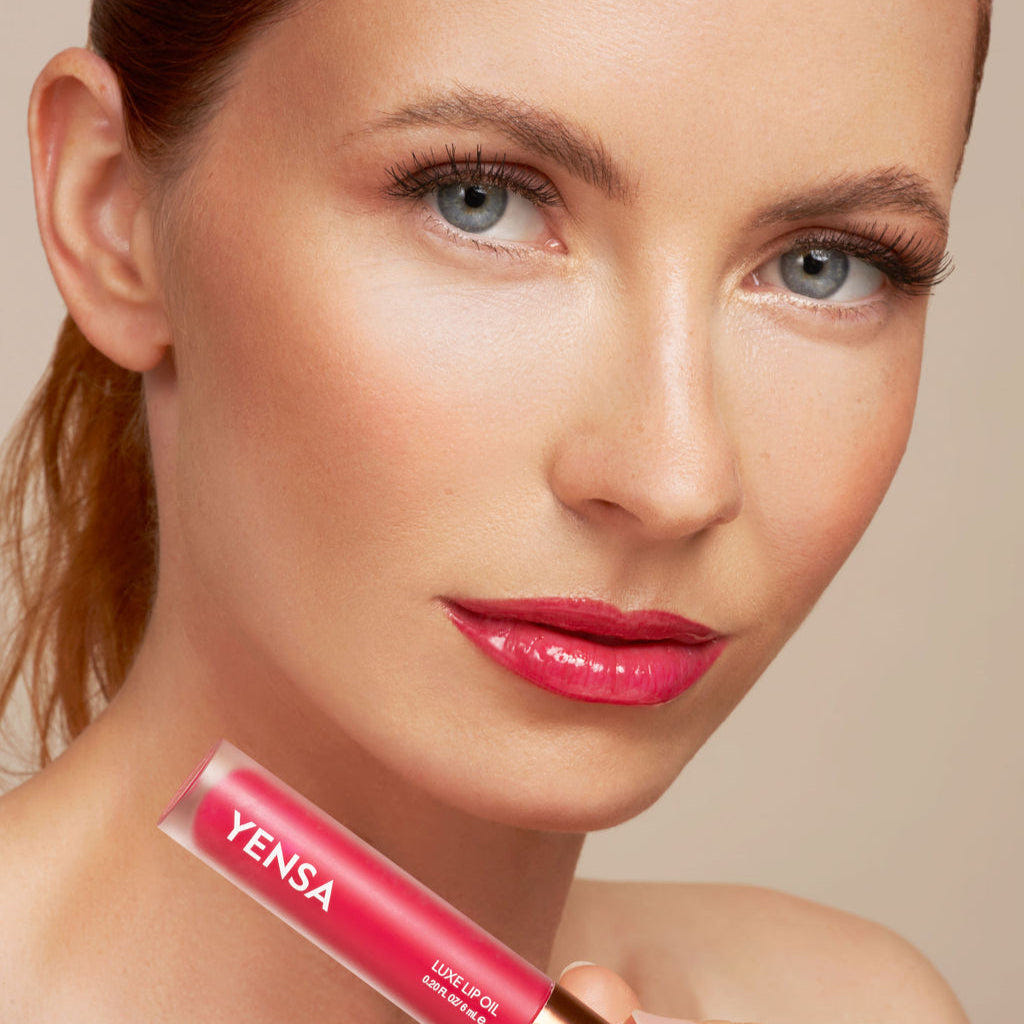 Model wearing YENSA Luxe Lip Oil in Power Pink