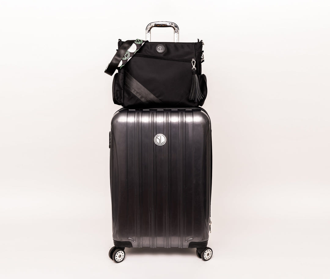 Tournament Traveler bag on a suitcase handle