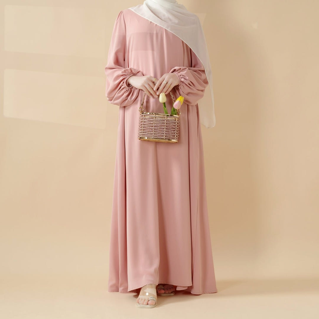 Softly pleated everyday abaya with a relaxed modest silhouette