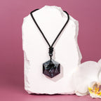 Black arfvedsonite hexagon pendant on adjustable cotton cord