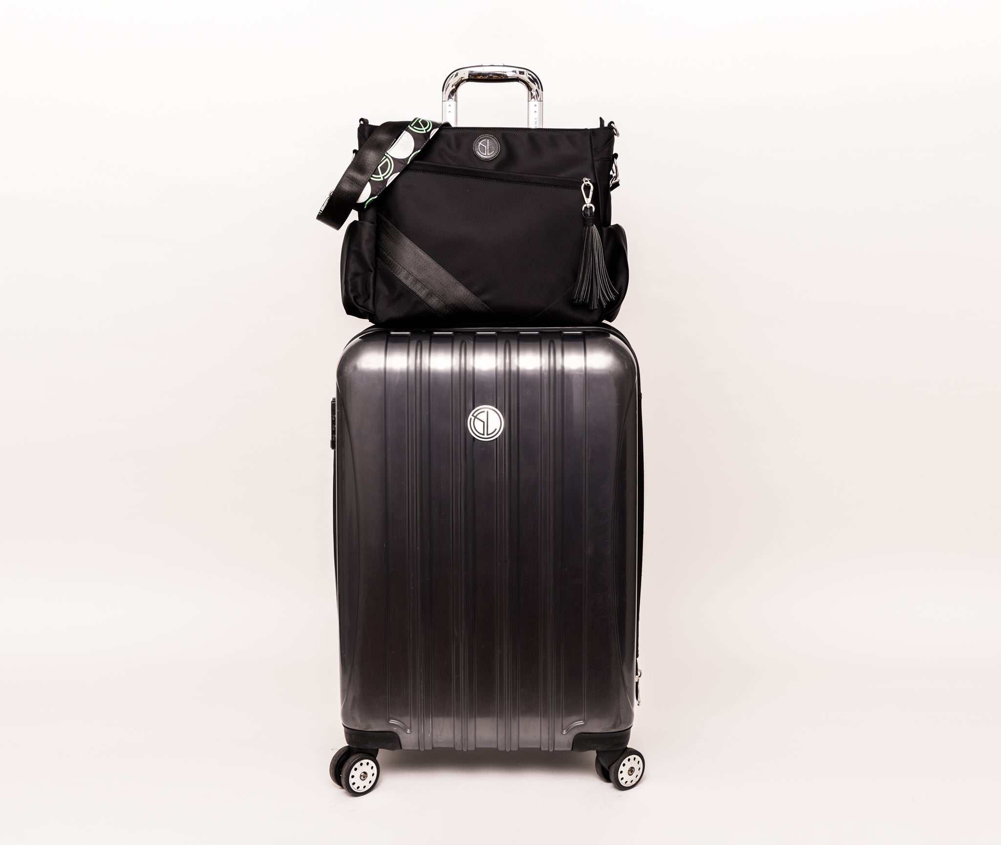 Tournament Traveler bag on a suitcase handle