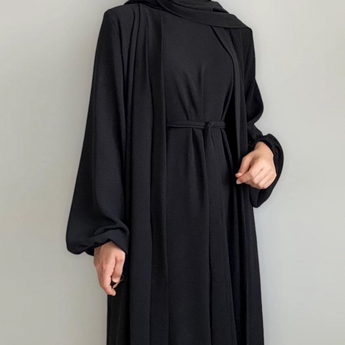Lightweight three-piece open abaya set showing controlled summer layering