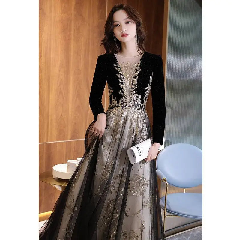 Gold embroidery detail on black evening gown view 5