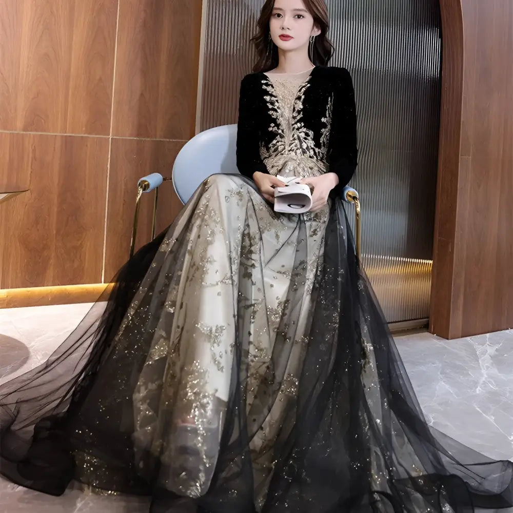 Black and gold embroidered long-sleeve gown view 1