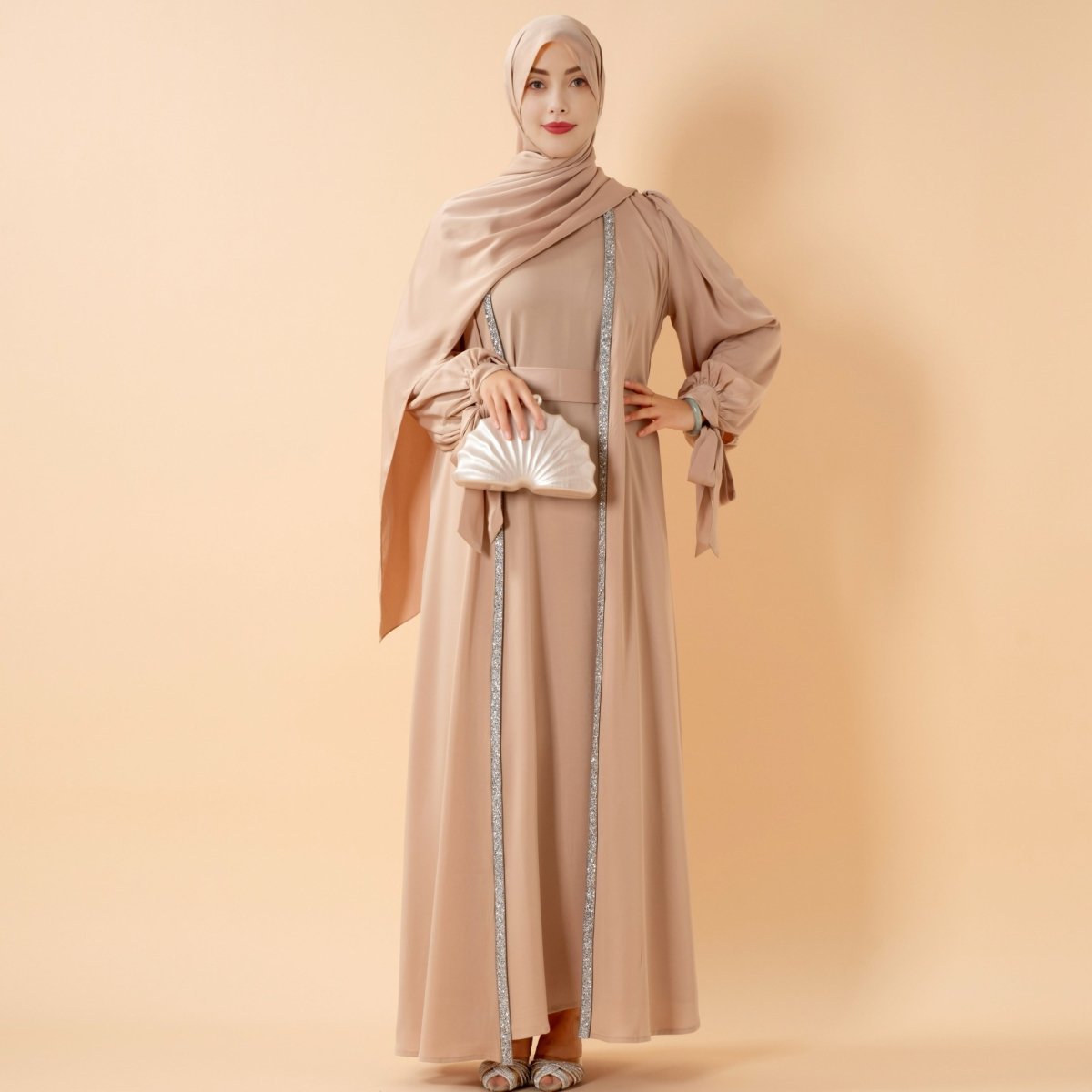 Bow-tie sleeve open abaya styled with a smooth long-sleeve inner dress