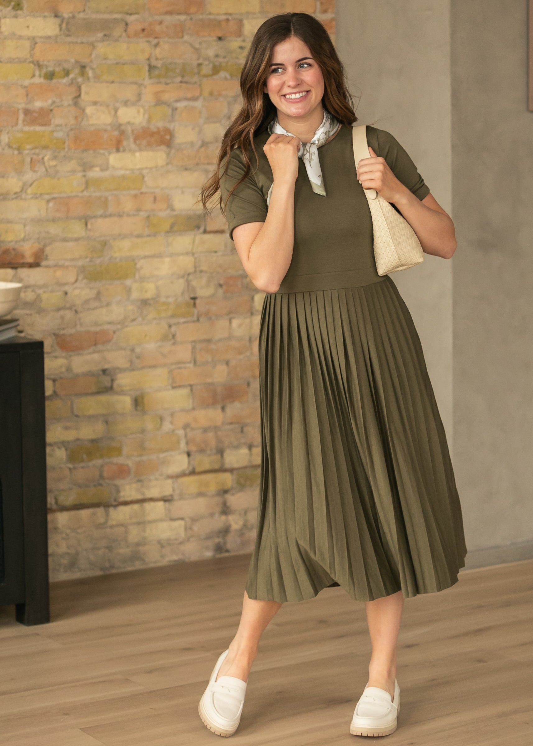 Olive semi-fitted midi dress with flowing pleated skirt