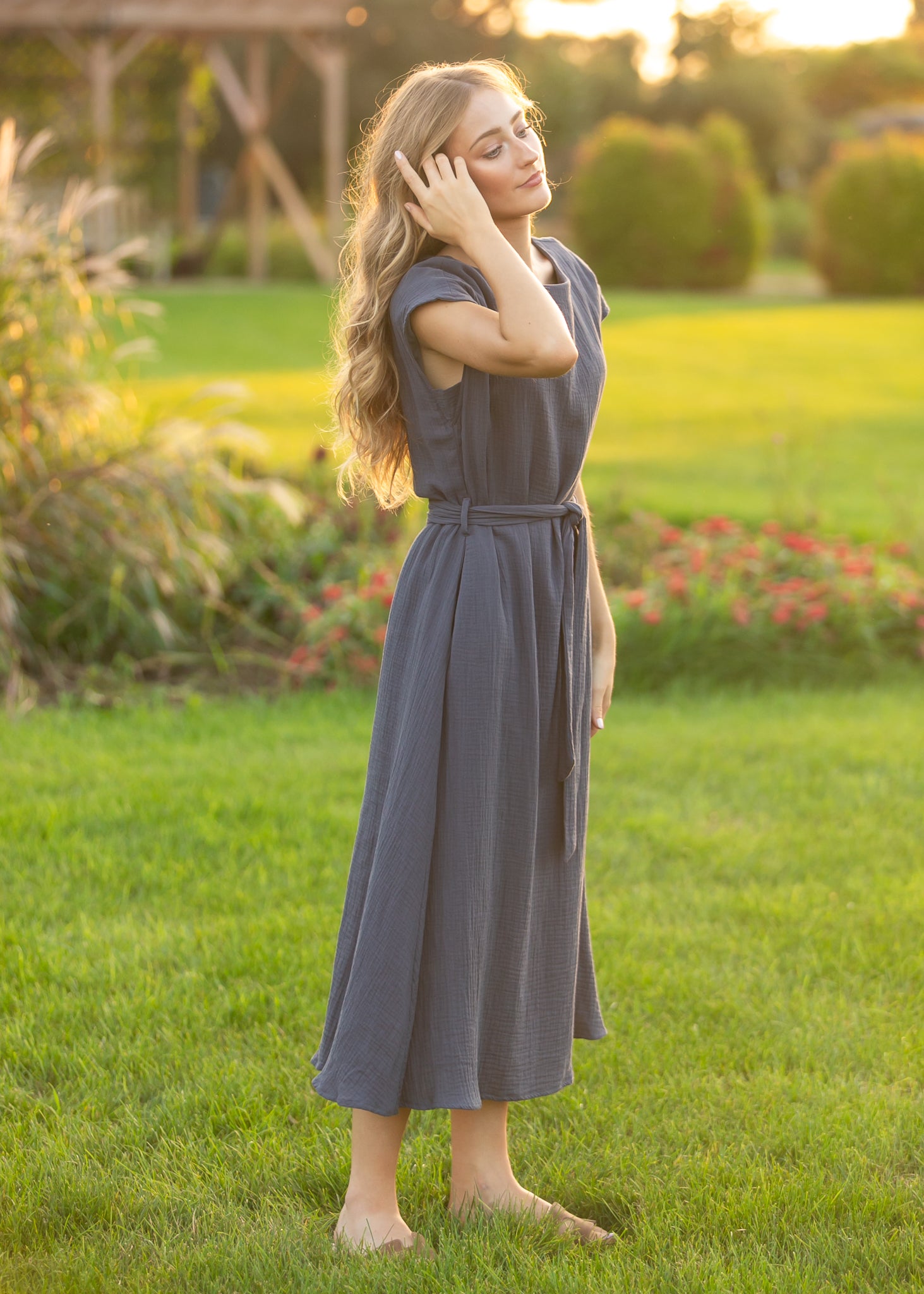 Lily navy cotton gauze midi dress styled with its waist belt