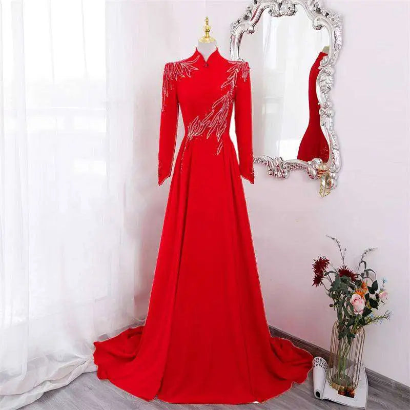 Red beaded long-sleeve gown, front view