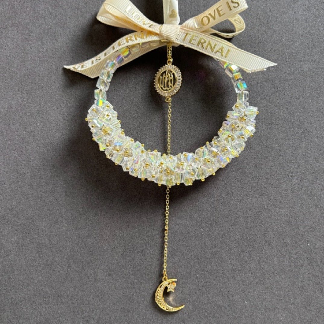 Crystal star and moon hanging ornament with polished metal frame