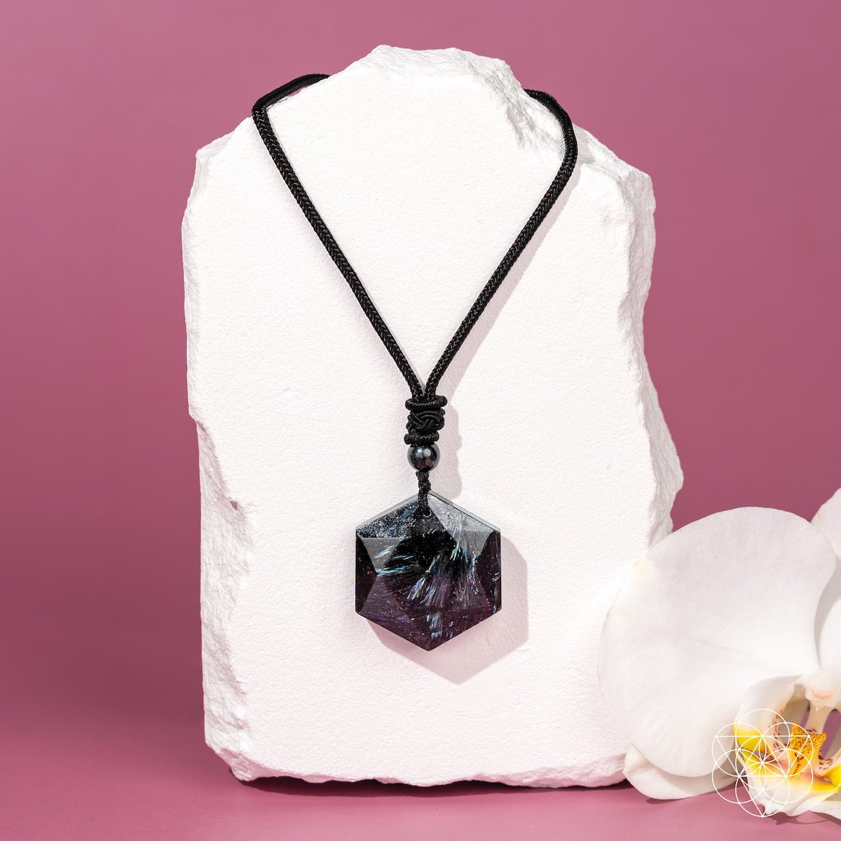 Black arfvedsonite hexagon pendant on adjustable cotton cord