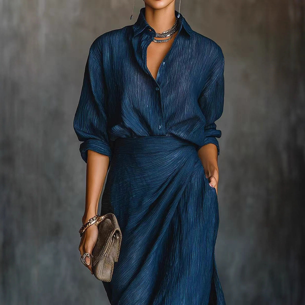 Blue pleated shirt and draped maxi skirt set, side view
