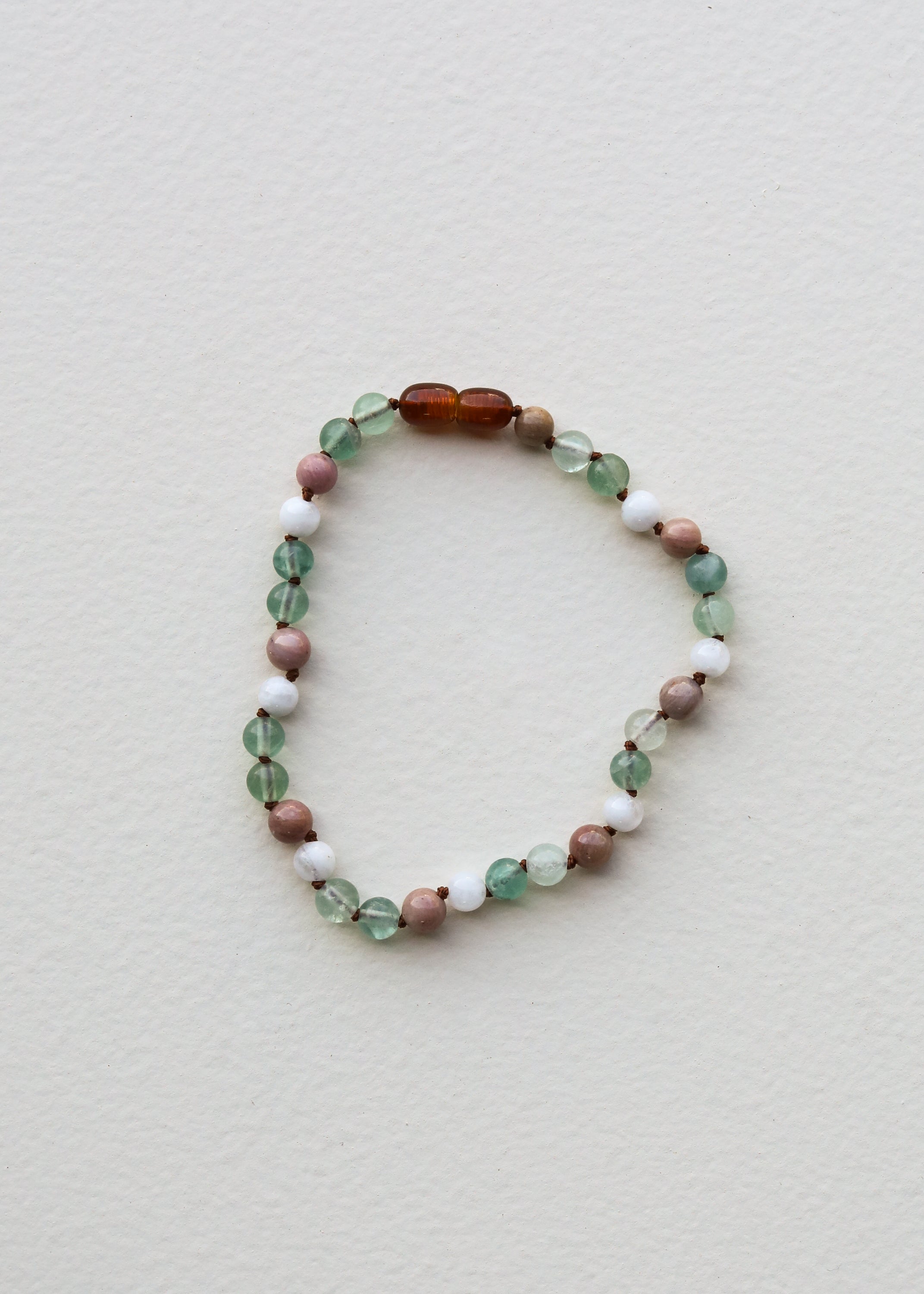 Fluorite, moonstone and rhodonite bracelet, close-up detail