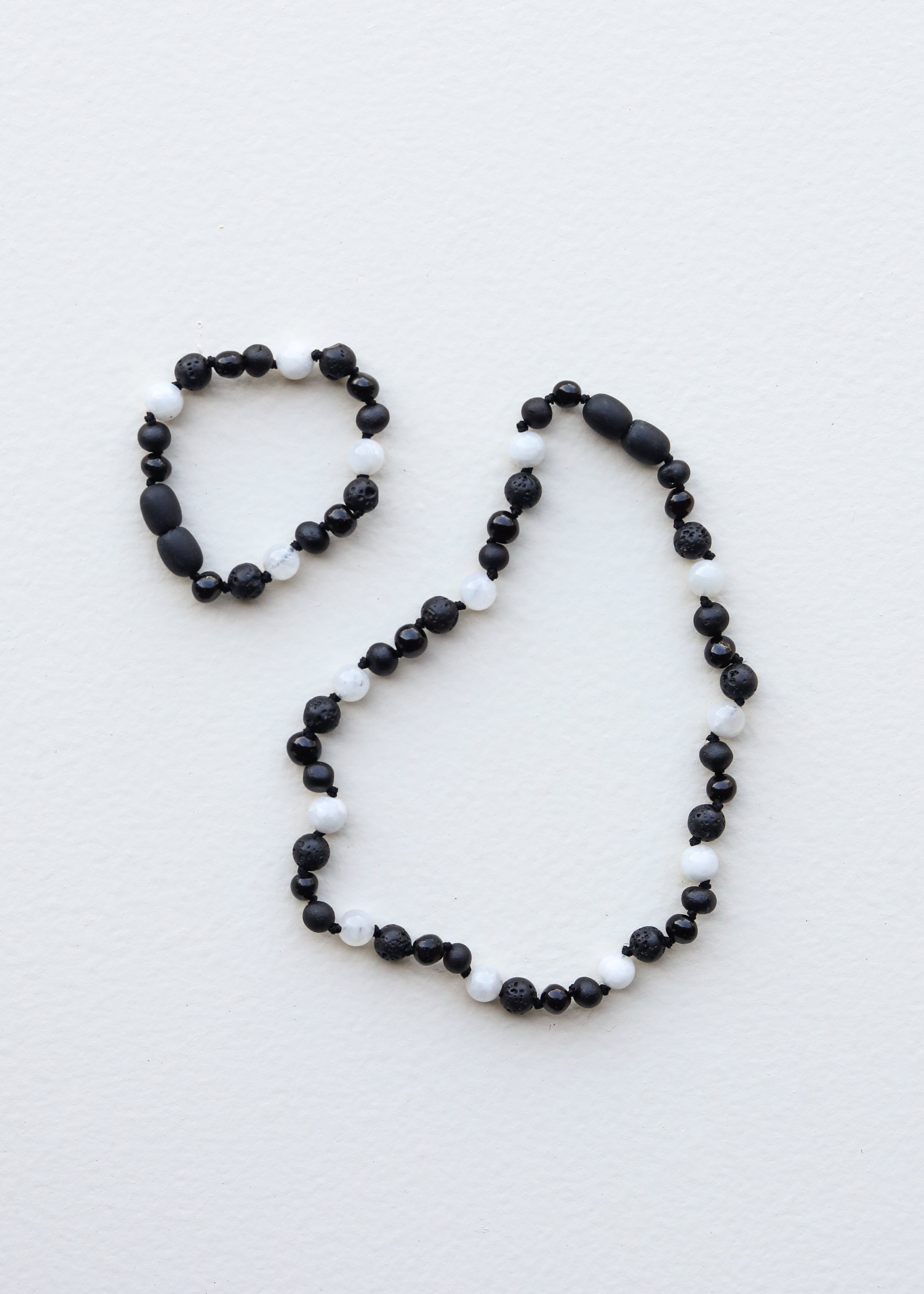 Black Baltic amber and moonstone bracelet, close-up detail
