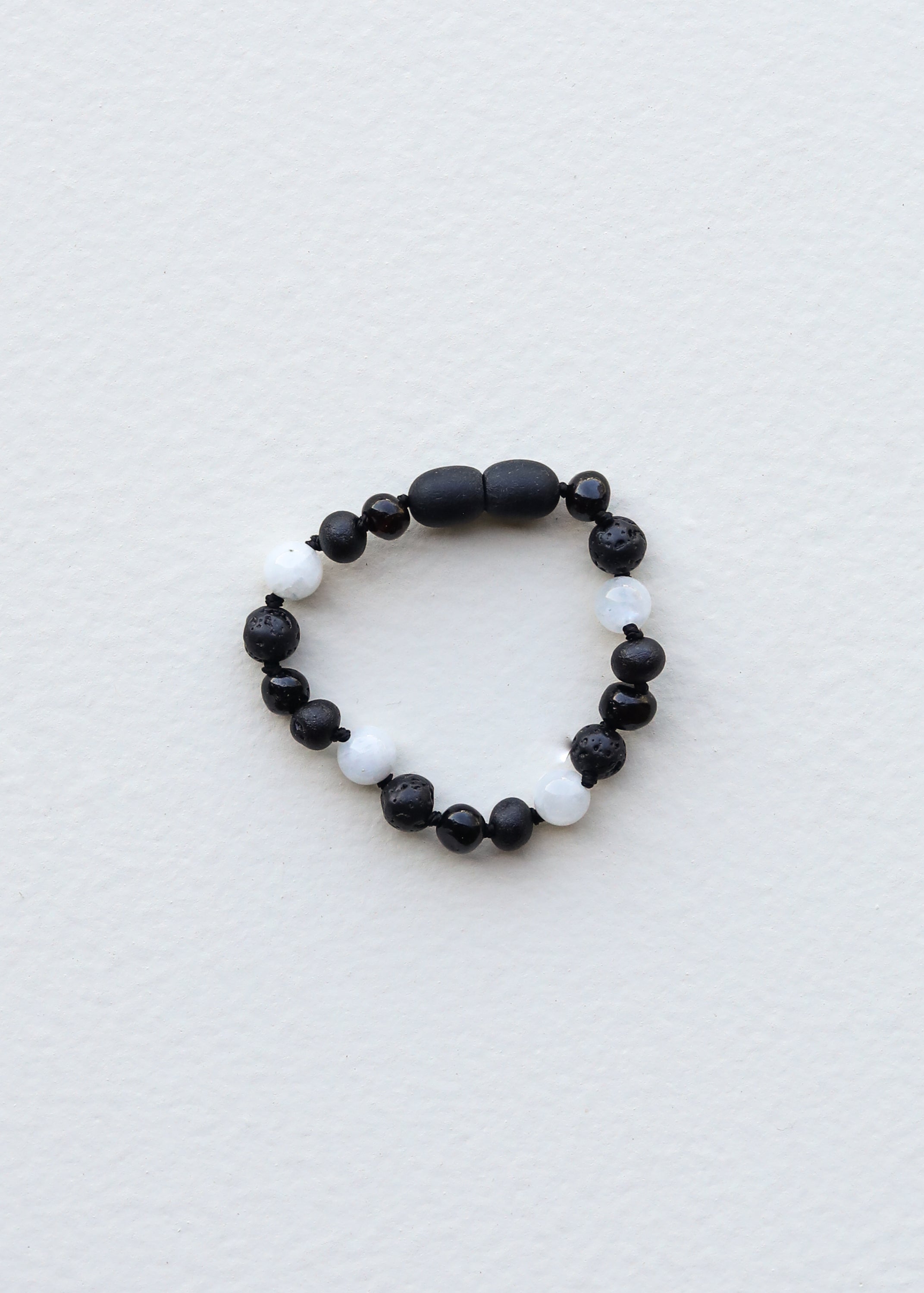 Black Baltic amber and moonstone beaded bracelet
